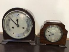 A vintage Enfield mantel clock in a bakelite case with silvered dial, striking hammer on coil
