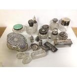 A quantity of assorted silver including toiletry bottles with silver tops and lids, a guilloche