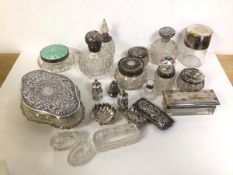 A quantity of assorted silver including toiletry bottles with silver tops and lids, a guilloche