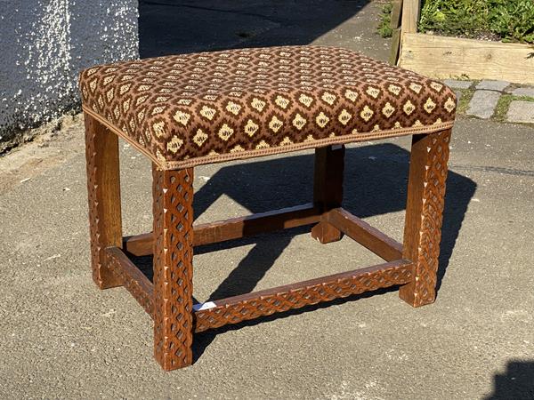 A 19thc oak stool, the upholstered top raised on square section supports and stretchers with blind