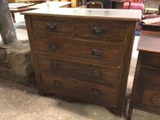 An Edwardian chest of drawers with two drawers above three long drawers, on bracket feet (100cm x