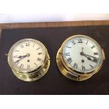 An early 20thc bulkhead type ship's wall clock in a brass and bevelled glass case, the white painted