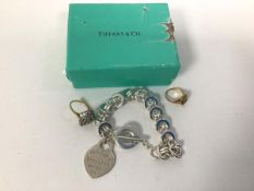 A Tiffany & Co. bracelet marked 925, with original box (44g) and two costume jewellery rings (a