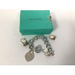 A Tiffany & Co. bracelet marked 925, with original box (44g) and two costume jewellery rings (a