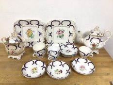 A part tea service, late 19thc/early 20thc with hand painted floral decoration within C scrolls,