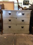 An Edwardian painted pine chest of three graduated drawers, on a skirted base (82cm x 99cm x 54cm)