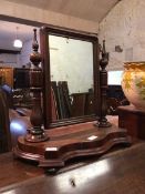 A Victorian mahogany dressing table mirror, the swing mirror raised on turned supports above a