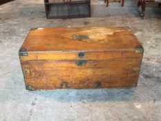 A 19thc camphorwood trunk, the hinged lid with brass bound corners, centred by a brass plaque