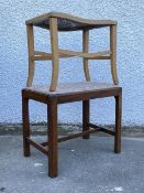 An Edwardian mahogany stool in the Georgian taste, the floral upholstered drop in seat pad above