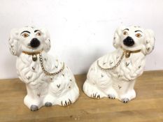 A pair of Beswick chimney spaniels, one with a Beswick stamp to base (26cm)