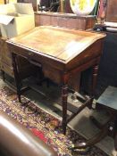 A Victorian mahogany clerk's writing desk, the raised back above a sloped writing surface, lifting