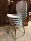 A set of six contemporary stacking dining chairs in the manner of Arne Jacobsen, with grey painted