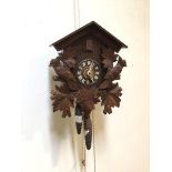 A 20thc West German cuckoo clock striking the hours and halves hammer on coil