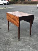 An early 19thc mahogany pembroke table, the rectangular top with two drop leaves with rounded