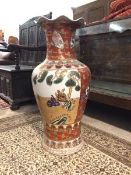 A large Kutani style modern floor standing vase, the flared scalloped rim above a baluster shaped
