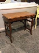 An early to mid 20thc oak campaign writing table, the rectangular moulded top above a frieze