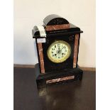 A Victorian architectural slate mantel clock, the white ivorine dial with Arabic chapter ring