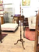 A 19thc and later mahogany floor lamp in the Sheraton taste, the baluster turned stem and triple