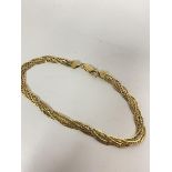 An 18ct gold double plaited flat link chain bracelet, stamped 750 (20cm) (8.71g)