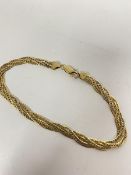 An 18ct gold double plaited flat link chain bracelet, stamped 750 (20cm) (8.71g)