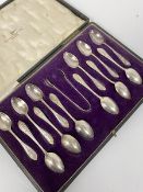 A case of twelve Sheffield silver Walker & Hall Onslow style pattern coffee spoons complete with