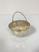 A Victorian Sheffield silver swing handled sweetmeat basket of half lobed design (5cm x d.9cm) (72.