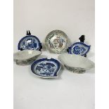 A graduated set of three 19thc boteh serving plates decorated with underglaze blue landscape with