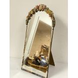 A 1920s barbola arched framed dressing mirror with easel stand and bevelled glass plate (66cm x