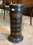 A Regency inspired 20th century coopered oak cylindrical stick stand, with lion mask handles and