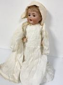 A Simon & Halbig German bisque head doll, impressed mark verso and number 126, with cry and flirty