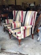 Parker Knoll - A Pair of mid to late 20th century wingback armchairs, upholstered in a striped