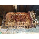 A Large nomadic Baluchi type saddle bag/ bag faced rug in the form of a cushion, 114cm, x 66cm