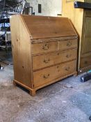 A late 19th century pine bureau, the fall front revealing fitted interior over two short and two