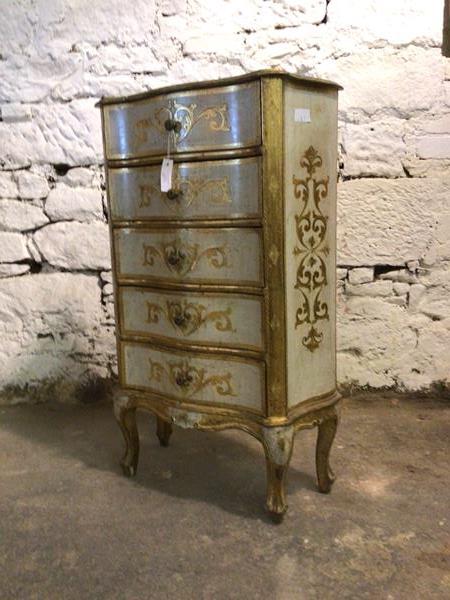 A 20th century Italian gilt and cream painted chest of serpentine outline, fitted with five drawers,