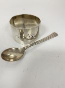 A Glasgow silver napkin ring (a/f), engraved with intials AMWSC and a Continental white metal
