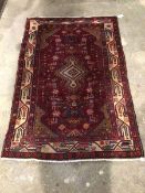 Persian Hamadan design red ground rug, with geometric design and bordered 152cm x 101cm