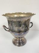 An Epns twin handled engraved ice bucket with scalloped chased border, raised on circular moulded