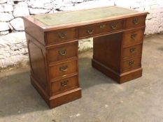 Georgian style yew wood twin pedestal desk, the top with inset green and tooled writing surface over