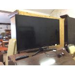 A Samsung 37" flat screen TV with power lead and remote