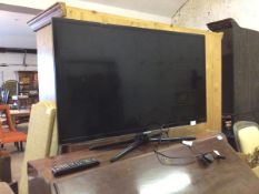 A Samsung 37" flat screen TV with power lead and remote