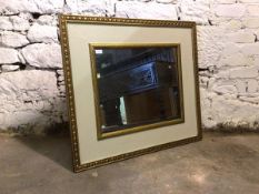 A gilt and cream painted rectangular wall hanging mirror 84cm x 94cm