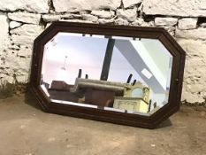 An early 20th century oak framed wall hanging mirror with bevelled glass 80cm x 49cm