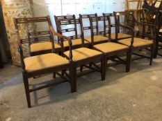 A near set of eight (6+2) Regency mahogany dining chairs, pierced rail backs over reeded uprights,