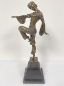 A reproduction cast bronze Deco style dancing figure, mounted on stepped and marble mounted base,