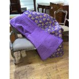 A 1920s comfy quilt company unused lavender and floral cornucopia design quilt, with original