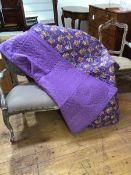 A 1920s comfy quilt company unused lavender and floral cornucopia design quilt, with original