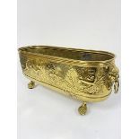 A brass rectangular rounded angle twin lion mask handled planter decorated with chased stag, hound