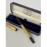 An American Watermans yellow metal engine turned presentation fountain pen to A Fergus Taylor, 3rd