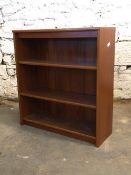 A Mid century teak floor standing bookcase fitted with two shelves, H98cm, W90cm, D33cm