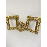 A pair of Florentine giltwood carved rectangular frames (inner: 16cm x 11cm) and a circular